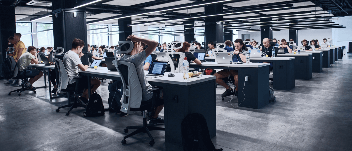 modern corporate employees working by their desks